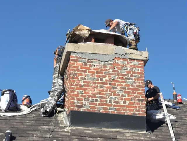 Trumbull Center Chimney Sweep installing a custom chimney crown in Trumbull Center, CT