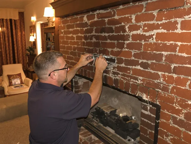Trumbull Center Chimney Sweep expert fixing a fireplace in Trumbull Center, CT